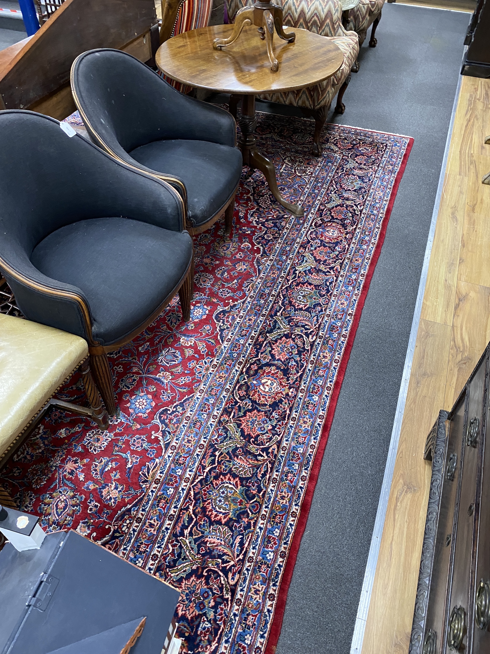 A Tabriz burgundy ground carpet, 460 x 330cm